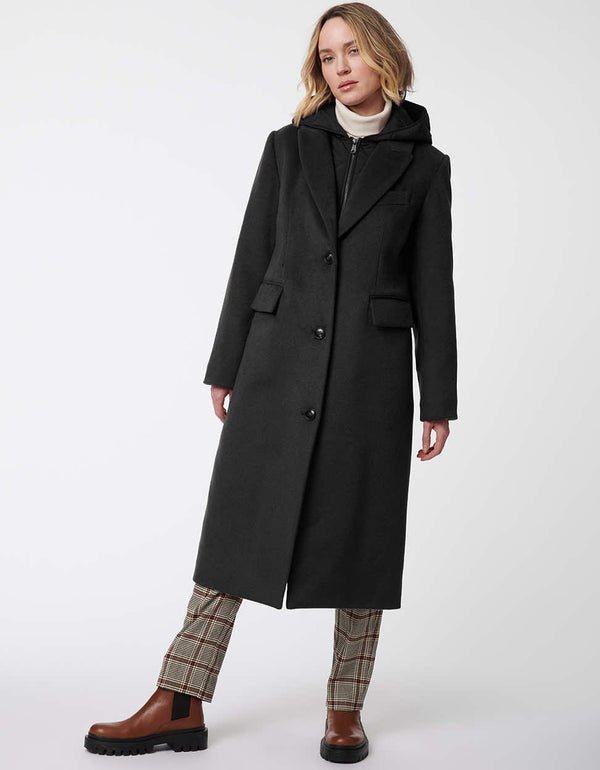 black knee length wool coat for women with modern features including a removable bib for added warmth and insulation