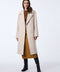 stylish putty or soft beige wool coat with a gentle drape and button accents offering chic look and warmth