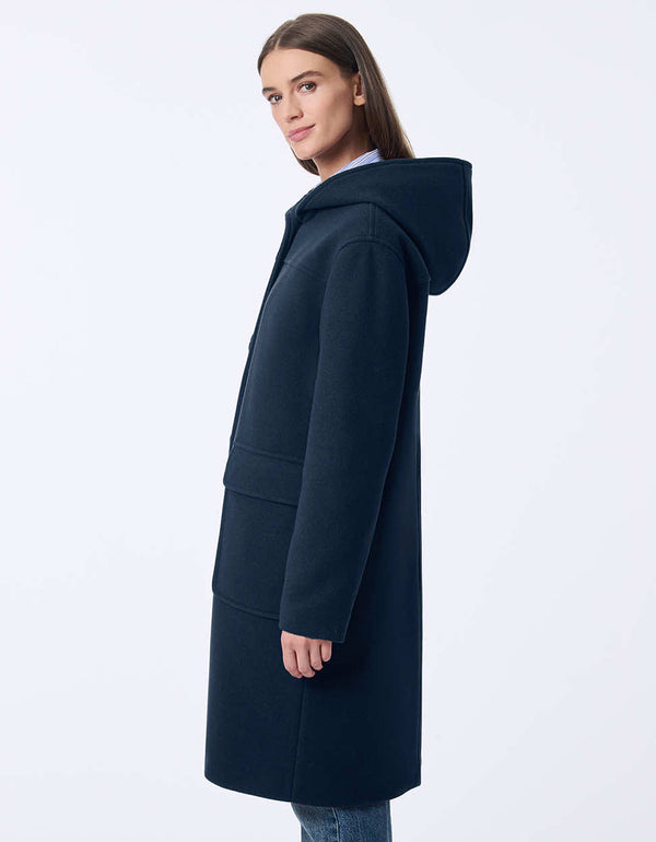 womens oversized coat with a relaxed fit knee length hood large buttons and patch pockets for modern casual style