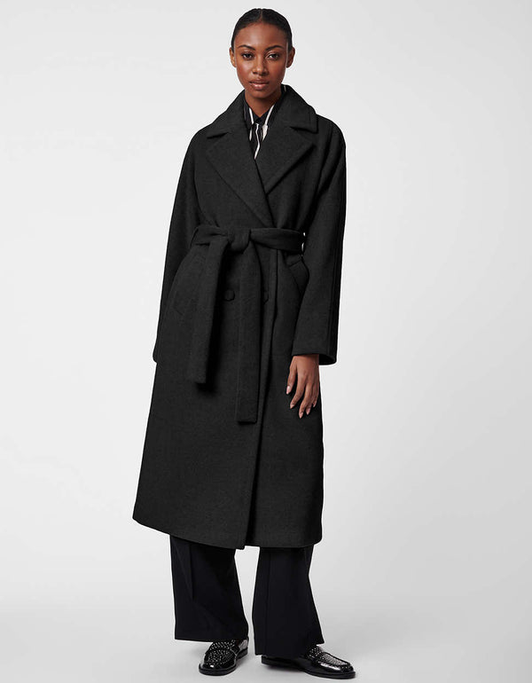 a statement black coat for women with wool material and flattering silhouette meant for every figure