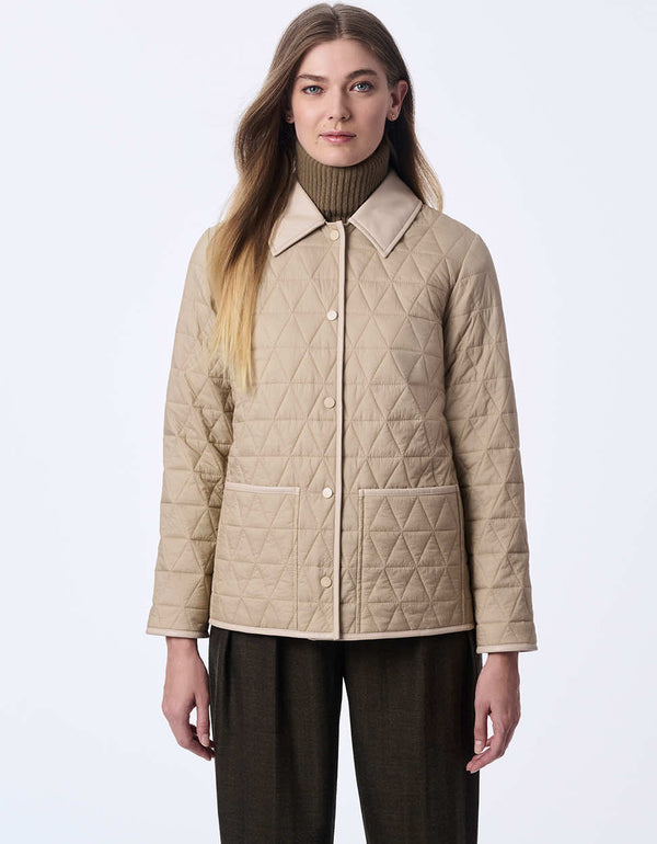 women's hip-length quilted jacket with faux leather trim. A sophisticated and effortless style for layering.