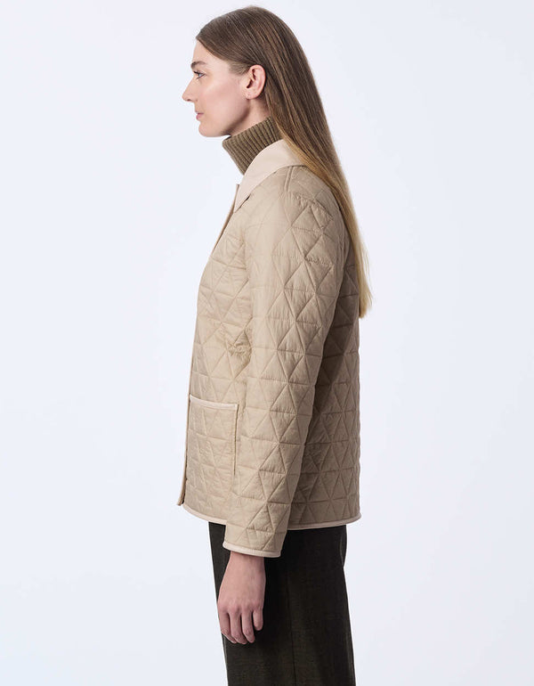 women's hip-length quilted jacket with faux leather trim. A sophisticated and effortless style for layering.