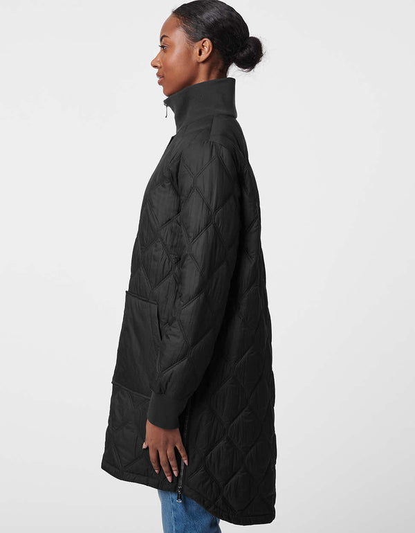 asymmetric puffer jacket in black with an elongated back and side zippers with quilted stitching for women