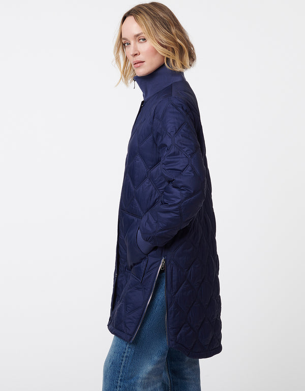 modern puffer jacket for women with quilted stitching and side zippers for comfortable movement