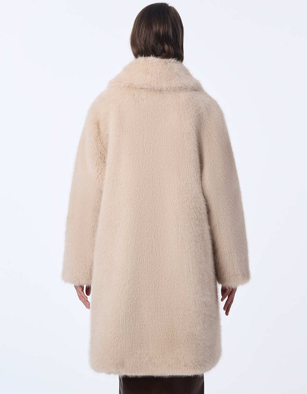 women's oversized faux fur coat with large contrast buttons, and stylish warmth. A luxurious look for your day or night.