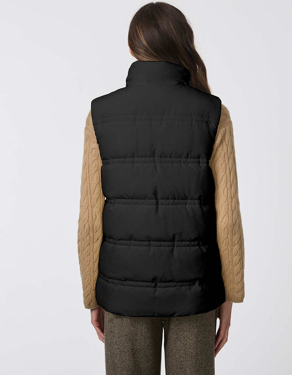 highly versatile pocketed puffer vest for women in black with a high collar and warm insulation