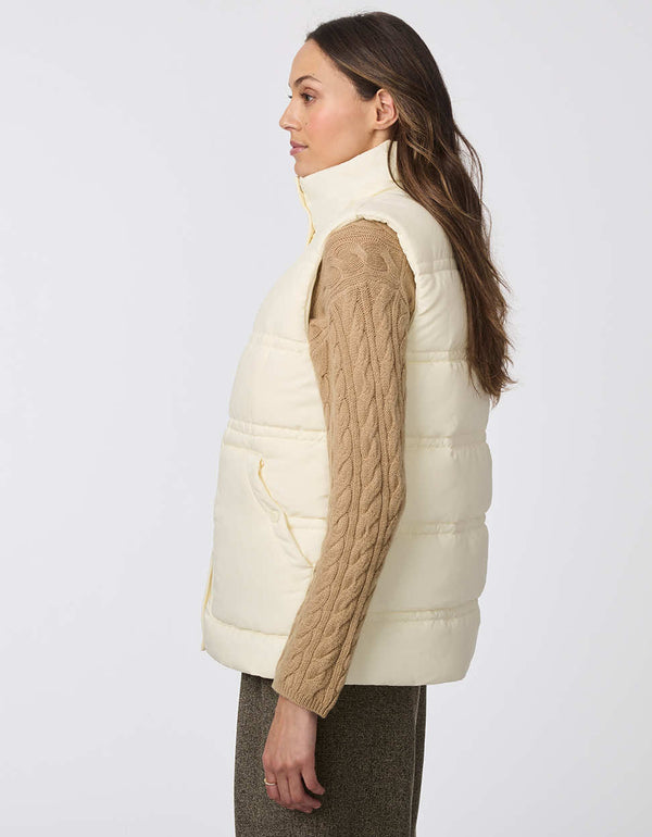 thick and insulated comfy puffer vest with large buttoned pockets perfect for women looking for a layering piece