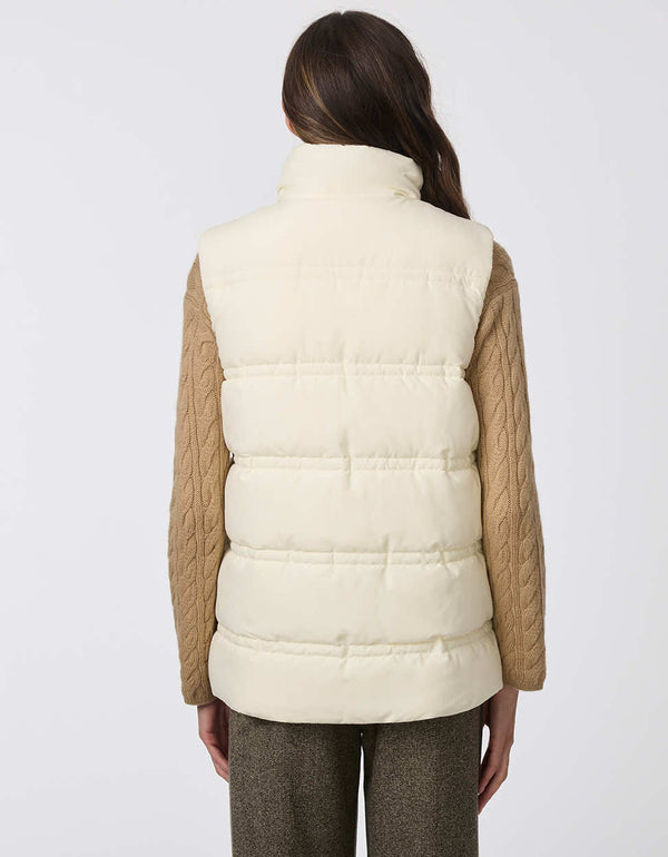 white cream colored puffer vest layering piece with sustainable insulation and large pocketed buttons