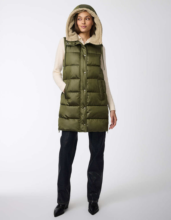 thigh length hooded sherpa lined puffer vest with horizontal stitching and button up enclosure for women in green