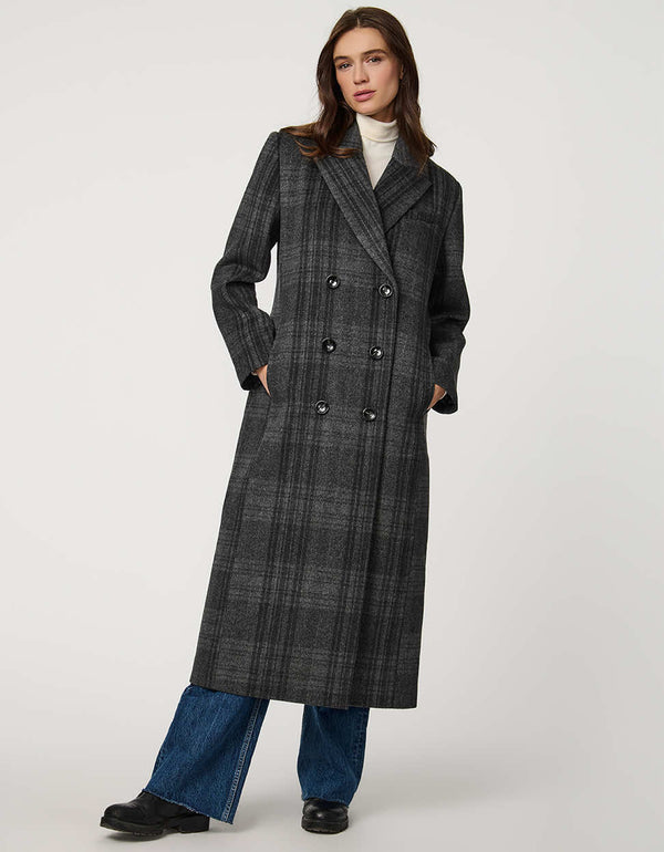 Women’s calf-length wool coat with double-breasted front and oversized lapels for modern tailored style.