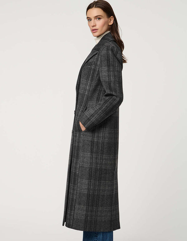 Women’s calf-length wool coat with double-breasted front and oversized lapels for modern tailored style.