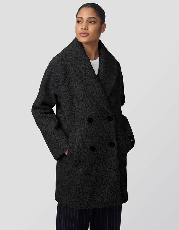 womens thigh-length oversized wool coat with fuzzy fabric and double-breasted design. Offers luxurious warmth and functionality, ideal for outdoor adventures with chic style.