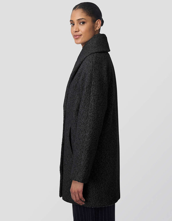 womens thigh-length oversized wool coat with fuzzy fabric and double-breasted design. Offers luxurious warmth and functionality, ideal for outdoor adventures with chic style.