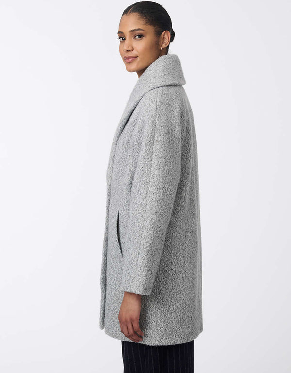 double breasted two pocket cozy wool coat with an oversized collar and silhouette fit for any occasion