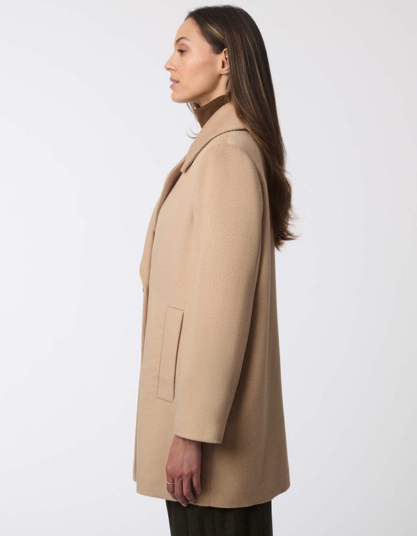 structured and oversized contemporary wool coat statement piece in a light brown color for women