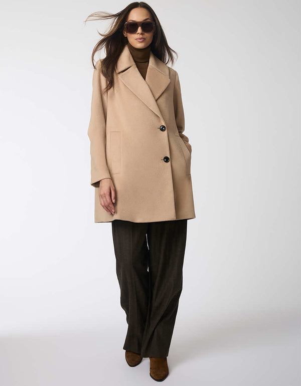 thigh length contemporary jacket for women in a camel color and oversized fit featuring a statement lapel