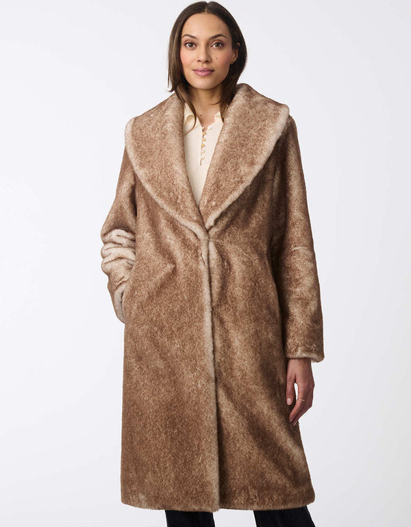 tan thigh length faux fur coat combining a loose oversized cut with fluffy softness for an elegant seasonal style