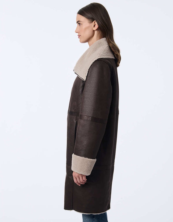 womens teddy and faux leather reversable coat. Cozy effortless style with a two-in-one design.