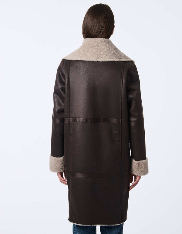 womens teddy and faux leather reversable coat. Cozy effortless style with a two-in-one design.