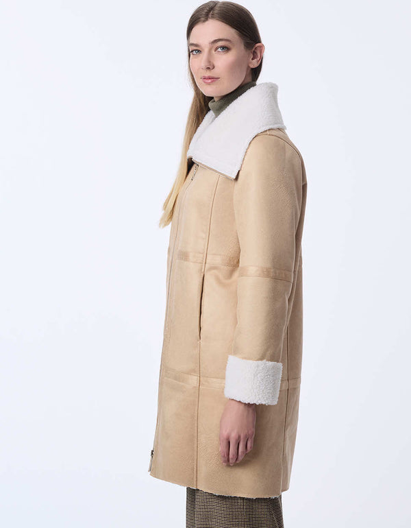 womens teddy and faux leather reversable coat. Cozy effortless style with a two-in-one design.