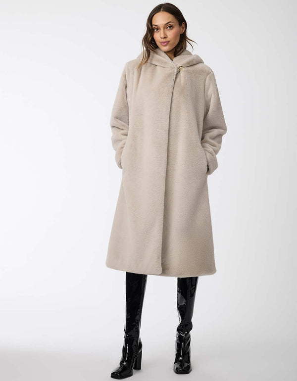 two pocket faux fur coat with an oversized fit and hood for women in soft mink for colder months