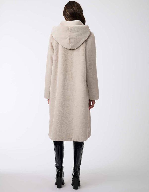 oversized faux fur coat with button closure and plush hood perfect for stylish warmth and comfort in winter months