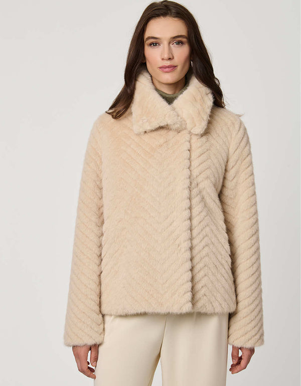 faux fur coat with dramatic collar and wide sleeves combining warmth and stylish flair
