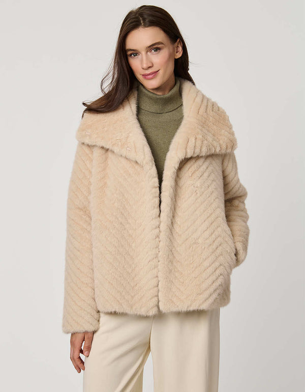 faux fur coat with dramatic collar and wide sleeves combining warmth and stylish flair