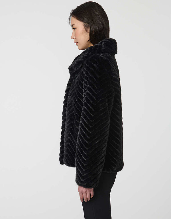faux fur coat with dramatic collar and wide sleeves combining warmth and stylish flair