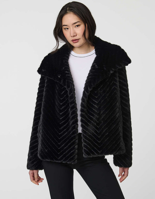 faux fur coat with dramatic collar and wide sleeves combining warmth and stylish flair