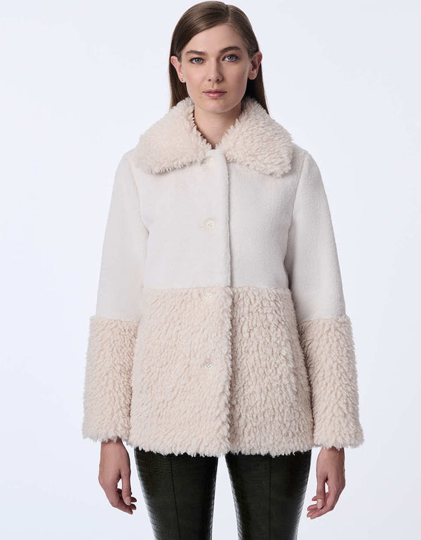 fashionable coat with large collar and sleek silhouette combining two textures for a bold winter statement