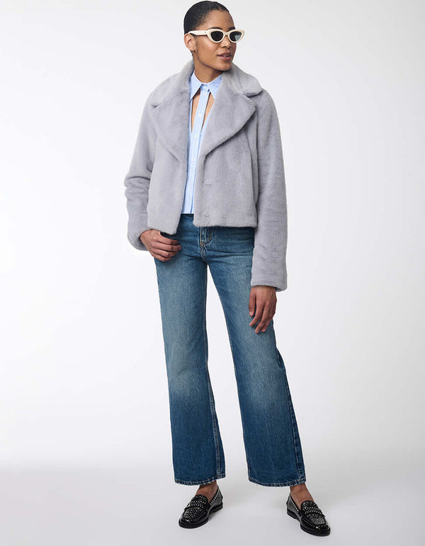 women's faux fur jacket with oversized labels and furrier clip closure. Hip-length for a modern style.