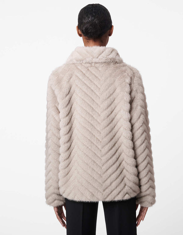 hip length grey fur jacket for women made from animal friendly fabric with herringbone detailing