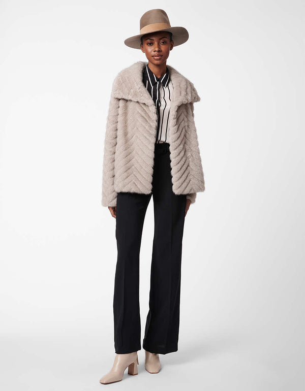 light grey hip length fur jacket with an exaggerated collar and stitched detailing for women