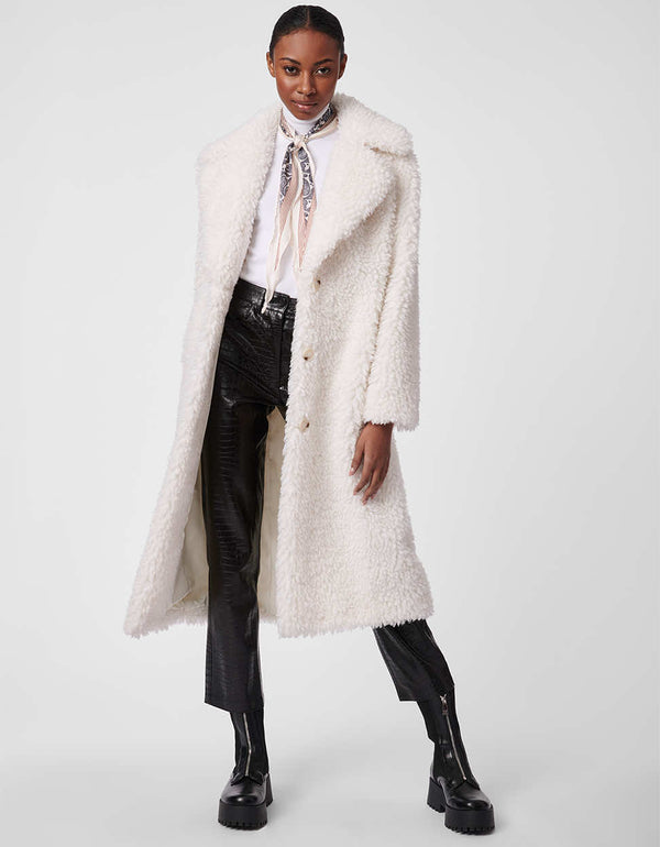 buttoned white faux fur coat for women made with animal friendly fabrics as a winter essential