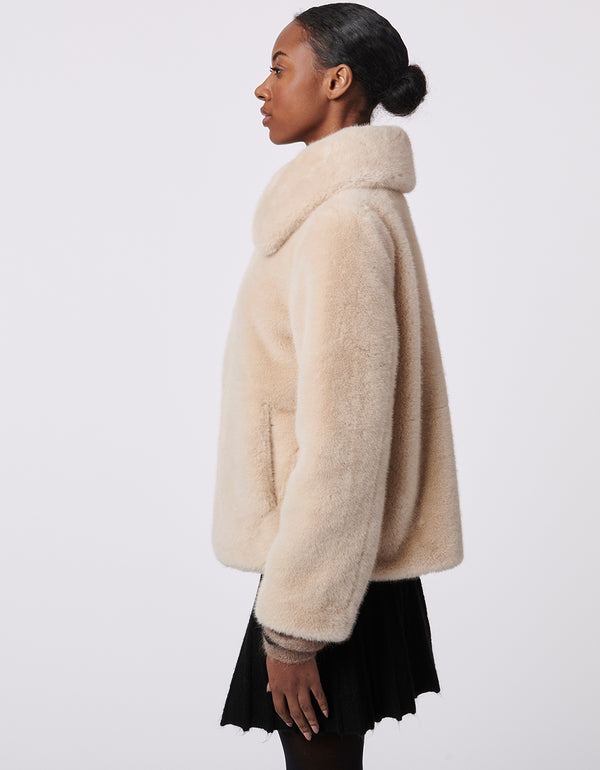 oatmeal colored faux fur zip up jacket for women with an oversized collar and a cozy classic cut