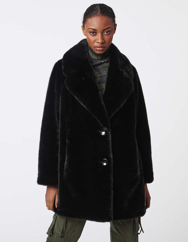 bold warm soft texture black faux fur coat for women with an oversized collar made from animal friendly fabrics