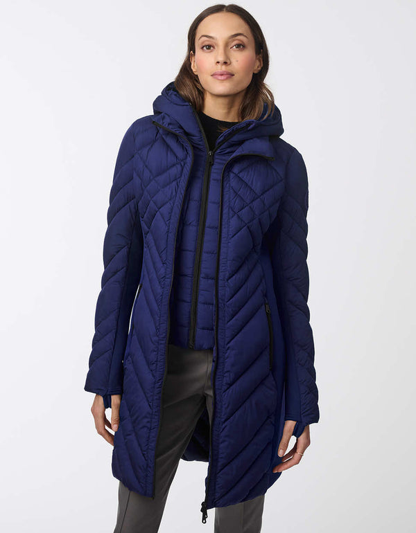 navy womens puffer walker with a mid length design removable hood and surprisingly light sustainable filler