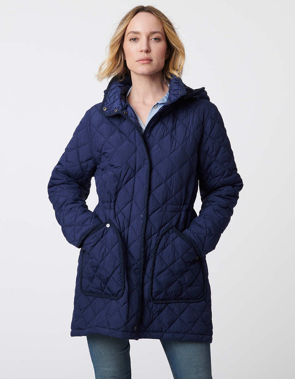 navy blue puffer jacket with quilted detailing with an adjustable hood and cinched waist for women