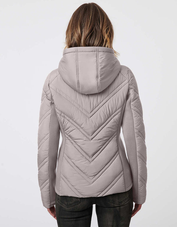 dual layered black slim fitting puffer jacket for women with thumbholes and zip up enclosure