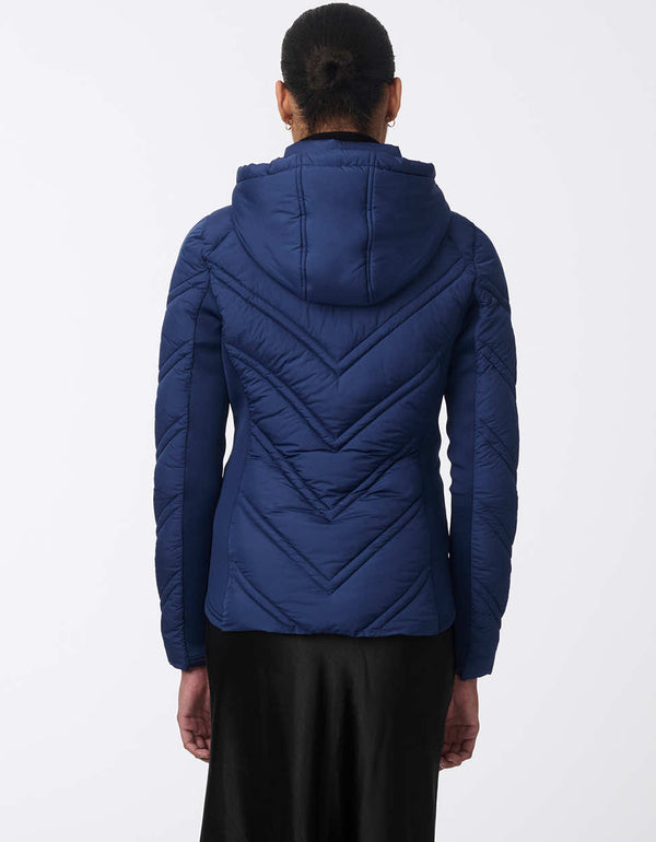 hooded sports zip up puffer jacket for women with thumbholes and removable bib in navy blue