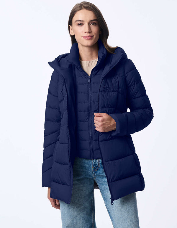 womens puffer coat with water-resistant fabric and removable bib. Features a cozy hood, modern stitching, and recycled insulation. Designed for extra warmth and sleek winter style.