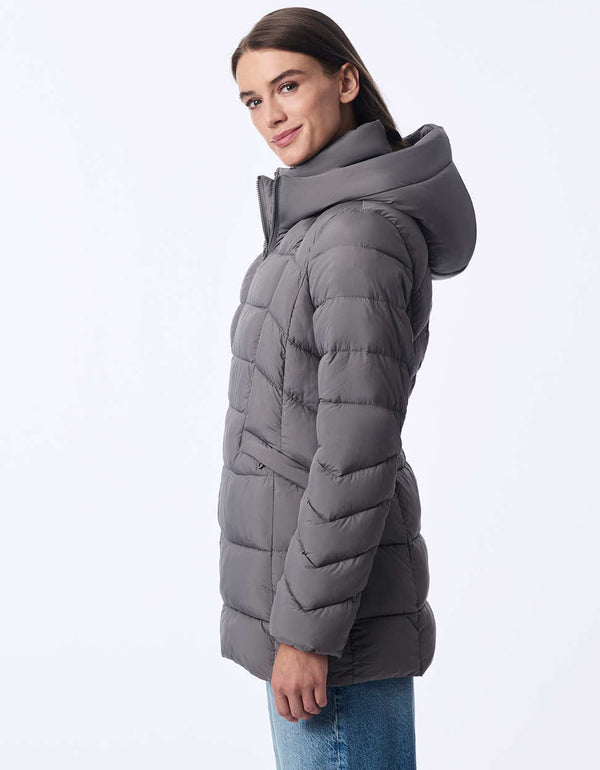 womens puffer coat with water-resistant fabric and removable bib. Features a cozy hood, modern stitching, and recycled insulation. Designed for extra warmth and sleek winter style.