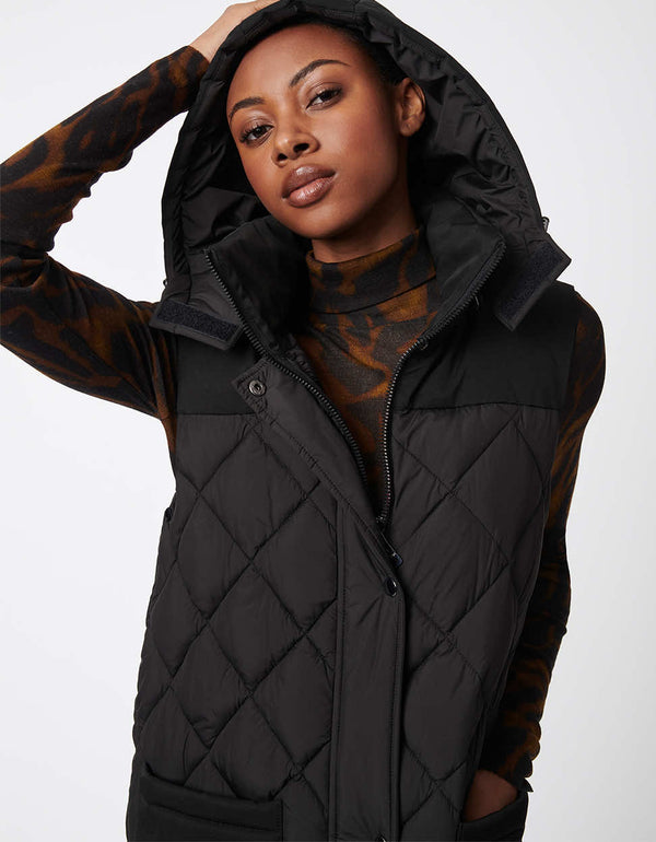 black oversized puffer jacket made from recycled materials perfect for layering during winter and rain