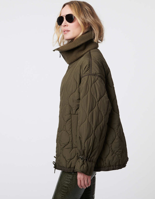 lightweight quilted jacket in olive green for women with ribbed oversized collar and adjustable waist and cuffs