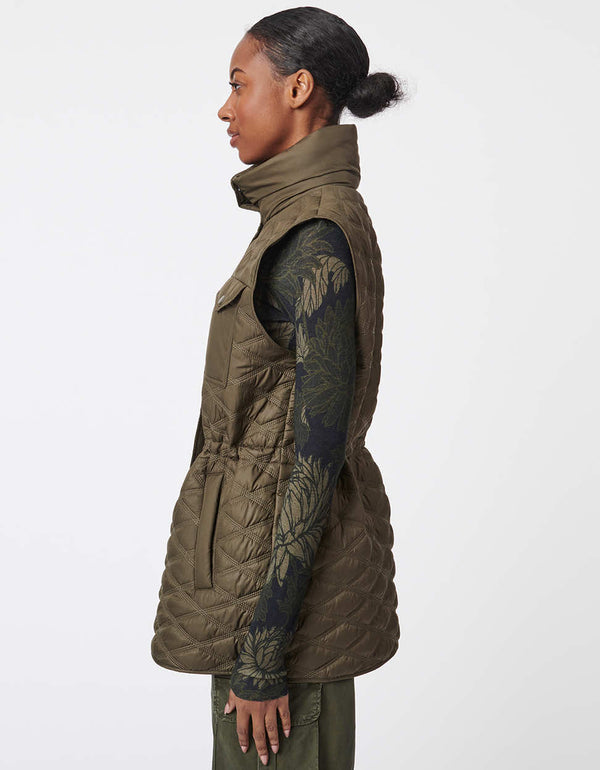 eco friendly puffer vest with concealed waist bungee and quilted design great for layering in cooler weather