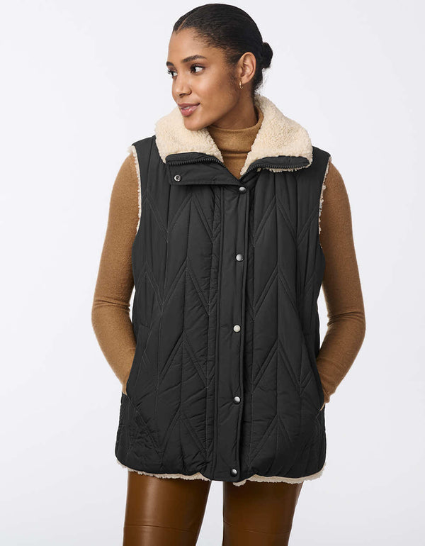 comfortable and cozy reversible black puffer vest with sherpa lined side for women for ultimate function and style