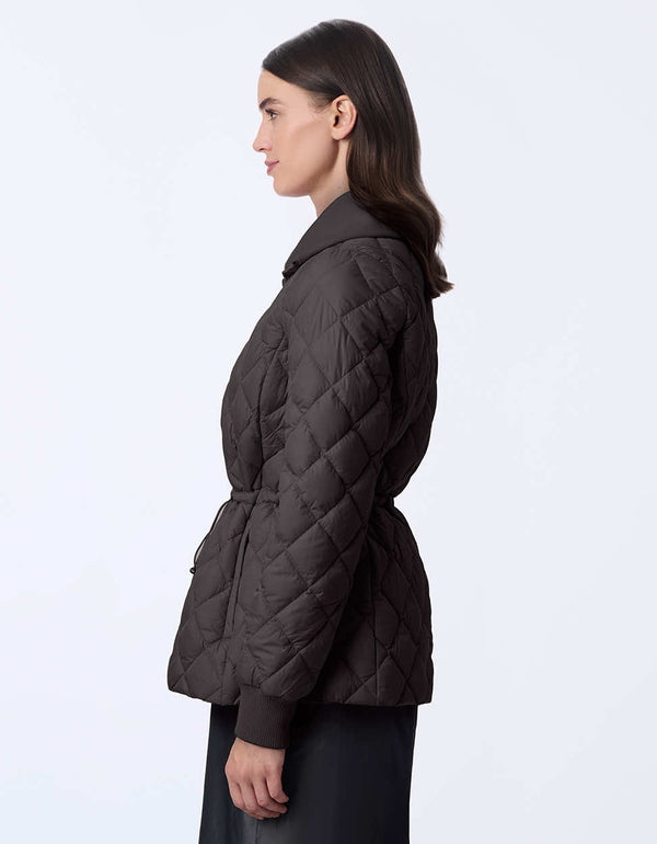 Women's quilted jacket with classic fit, hip-length design, and drawstring waist. Cinched wait for a chic silhouette