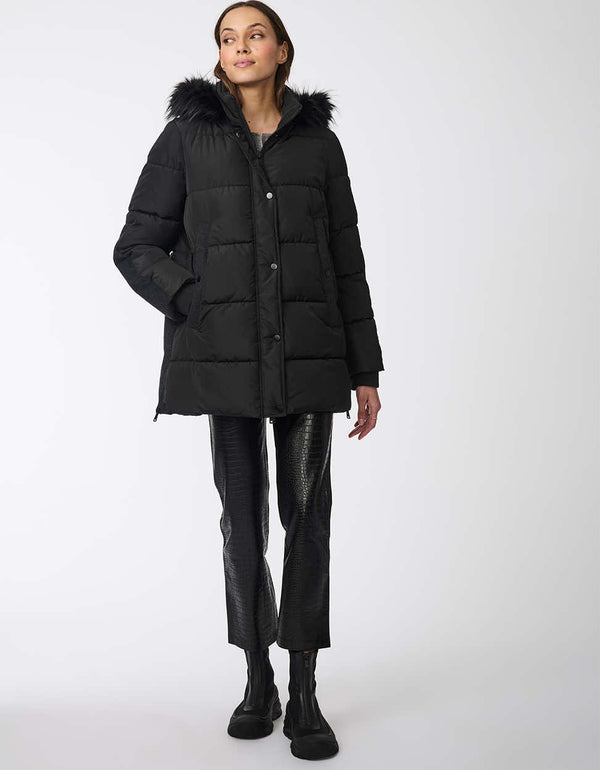 cozy puffer coat for women with a faux fur hood and button-up front in a black colorway and oversized fit