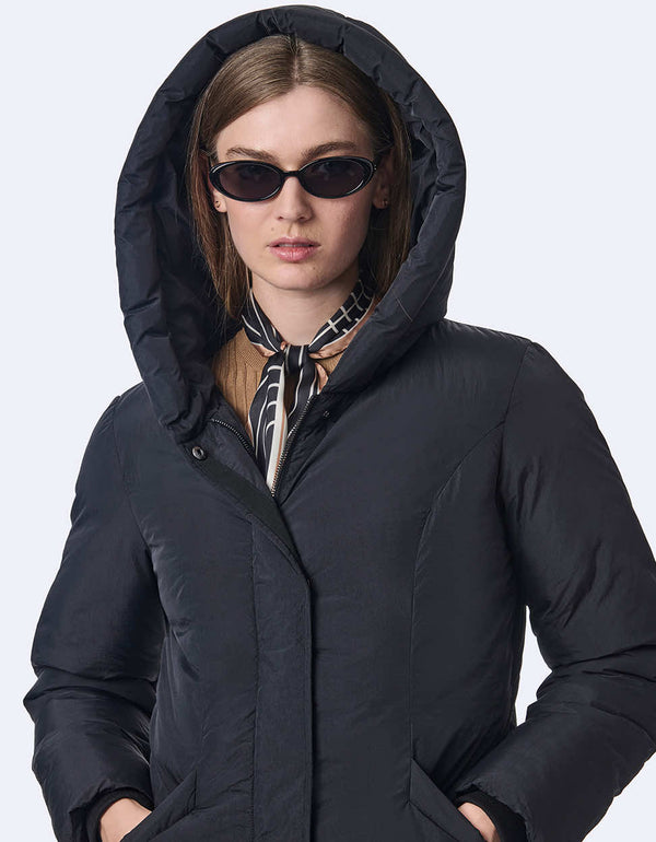 womens lightweight puffer coat with oversized hood. Made with recycled materials, this style keeps you cozy and fashionable.